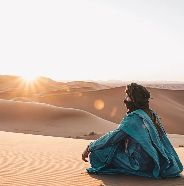 4 days tour from Fes to Marrakech showing camel trekking in Sahara Desert with luxury desert camp