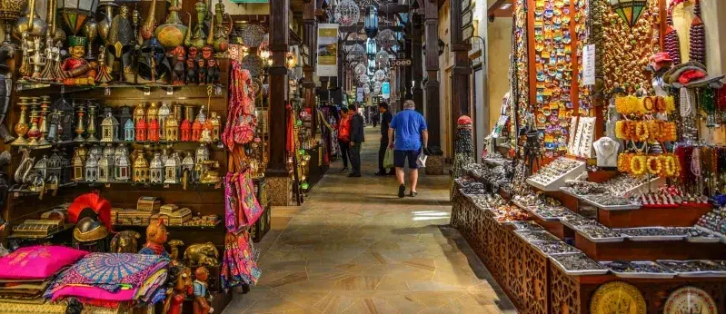  A vibrant narrow alleyway filled with an array of colorful items, creating a lively and inviting atmosphere in morocco travel tips 