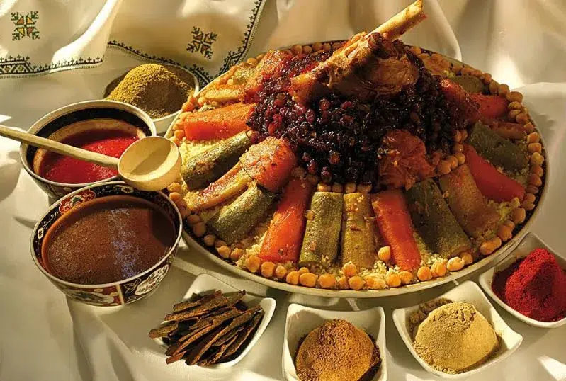  A plate filled with an assortment of colorful foods, showcasing a variety of textures and flavors in morocco travel tips 