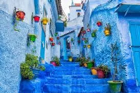 Blue-painted streets of Chefchaouen, Morocco, showcasing vibrant buildings and a serene atmosphere.7 Days Tour from Fes