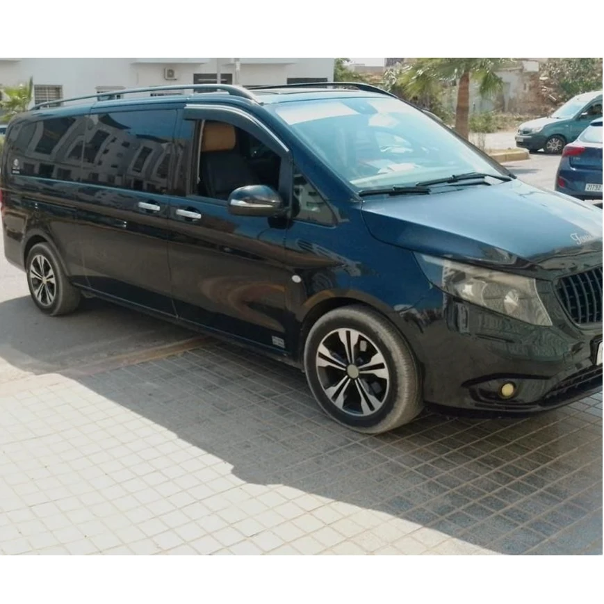 Driver meeting passengers at Marrakech Airport arrivals hall private transfer