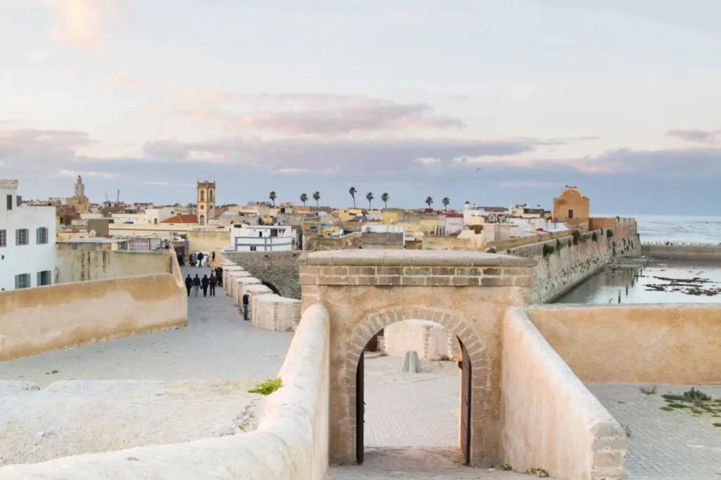 View from the top of the old city wall, showcasing historic buildings and a panoramic landscape beyond.
