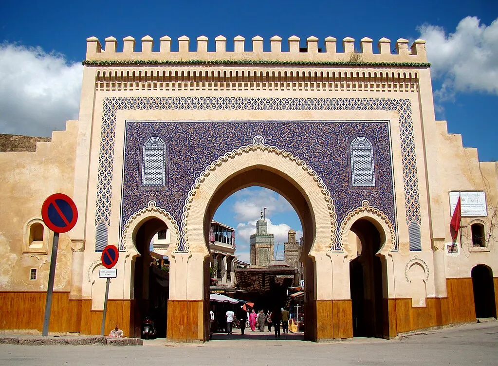 The entrance to fes , featuring traditional architecture and vibrant colors, welcoming visitors to the historic city. 