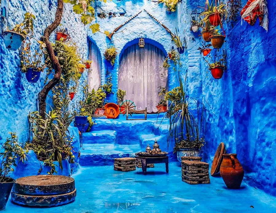 Scenic view of Chefchaouen, Morocco, showcasing its iconic blue-painted buildings and mountainous backdrop.11 Days Grand Morocco Tour from Casablanca