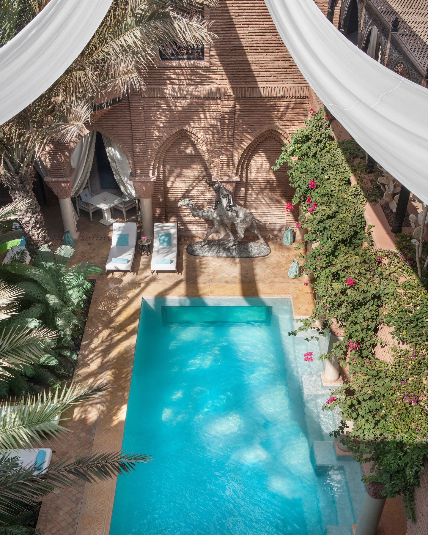 La Sultana Marrakech interior courtyard with intricate zellige tilework