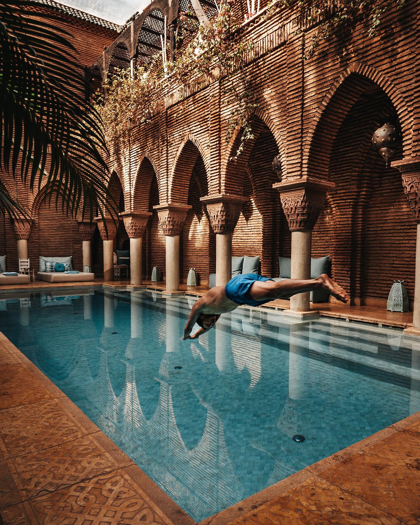 La Sultana Marrakech luxury riad exterior with Moorish architecture and candlelit terrace
