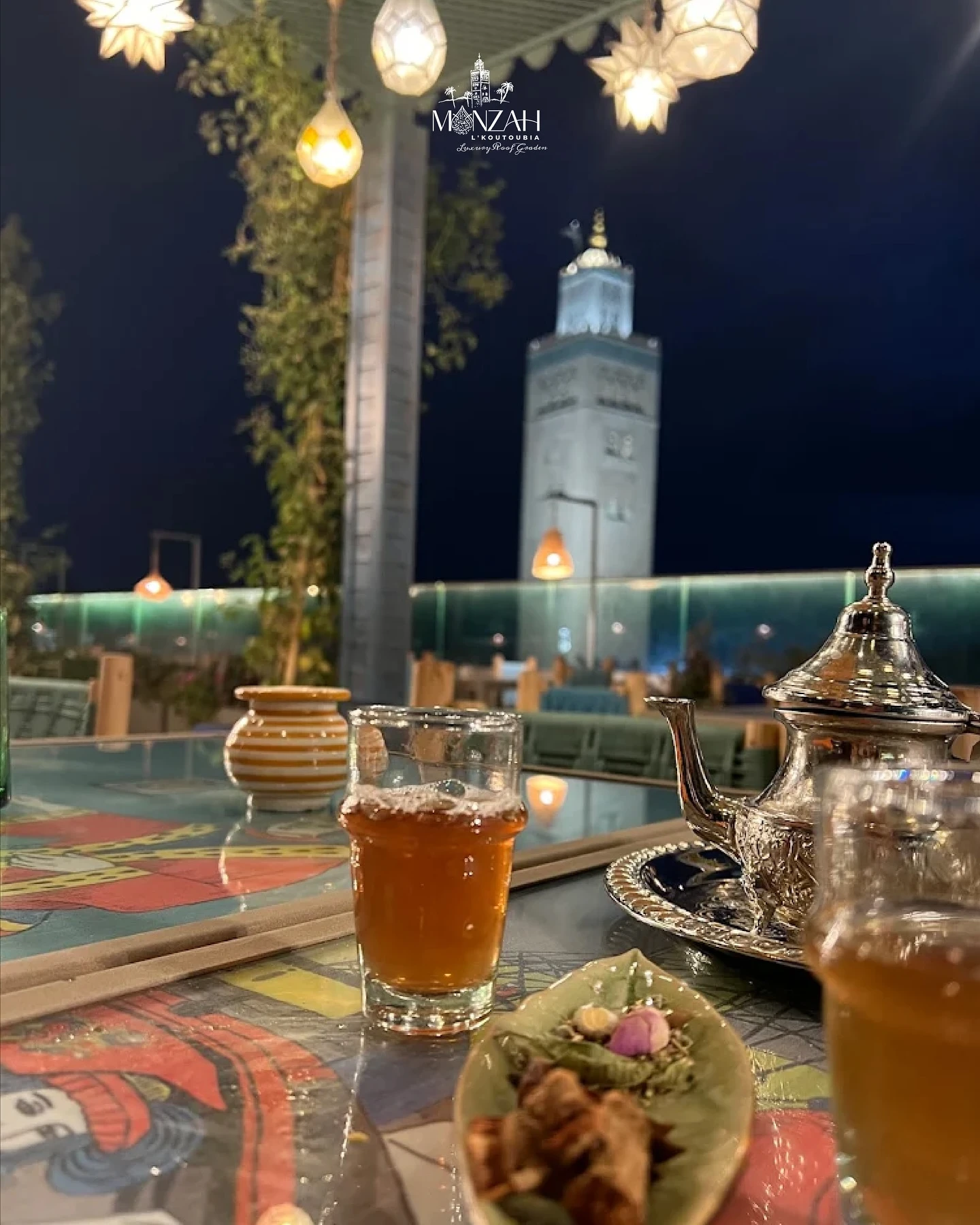 Jemaa el-Fnaa square at night with performers and traditional stalls in Marrakech