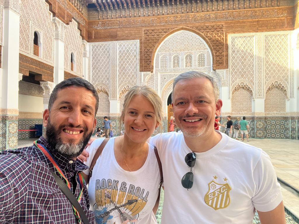 Mouhssine, licensed Marrakech local guide, with visitors at Ben Youssef Madrasa