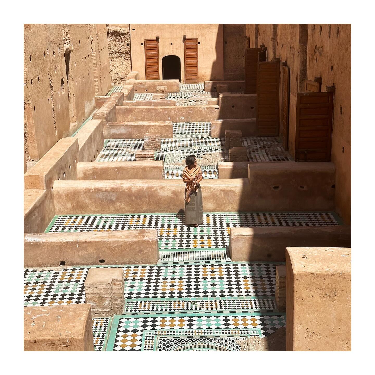 Saadian Tombs Marrakech interior with intricate stucco carvings and zellige tilework