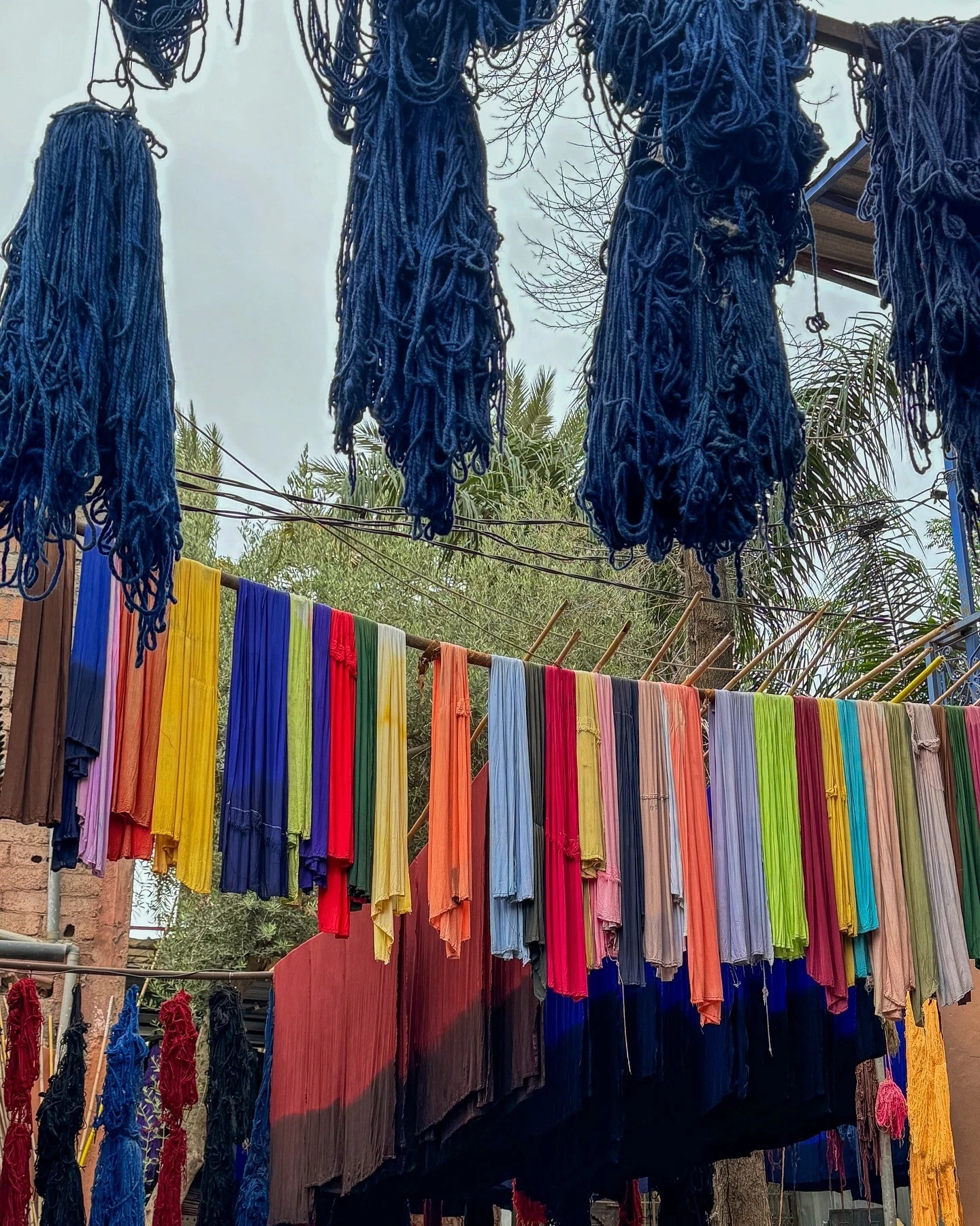 Traditional dyeing process in Souk Teinturiers with vibrant colored wool