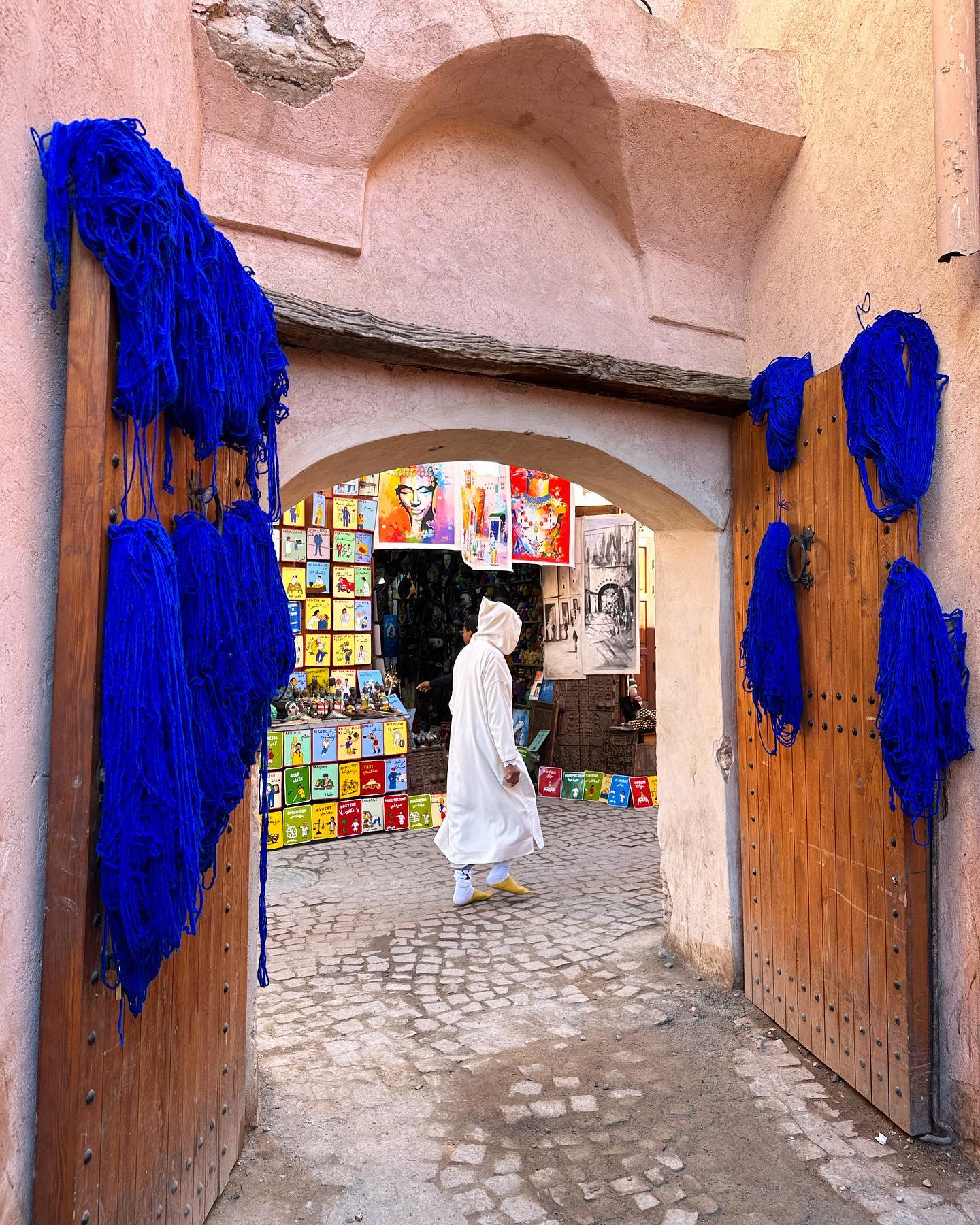 Freshly dyed fabrics hanging to dry in Souk Teinturiers Marrakech