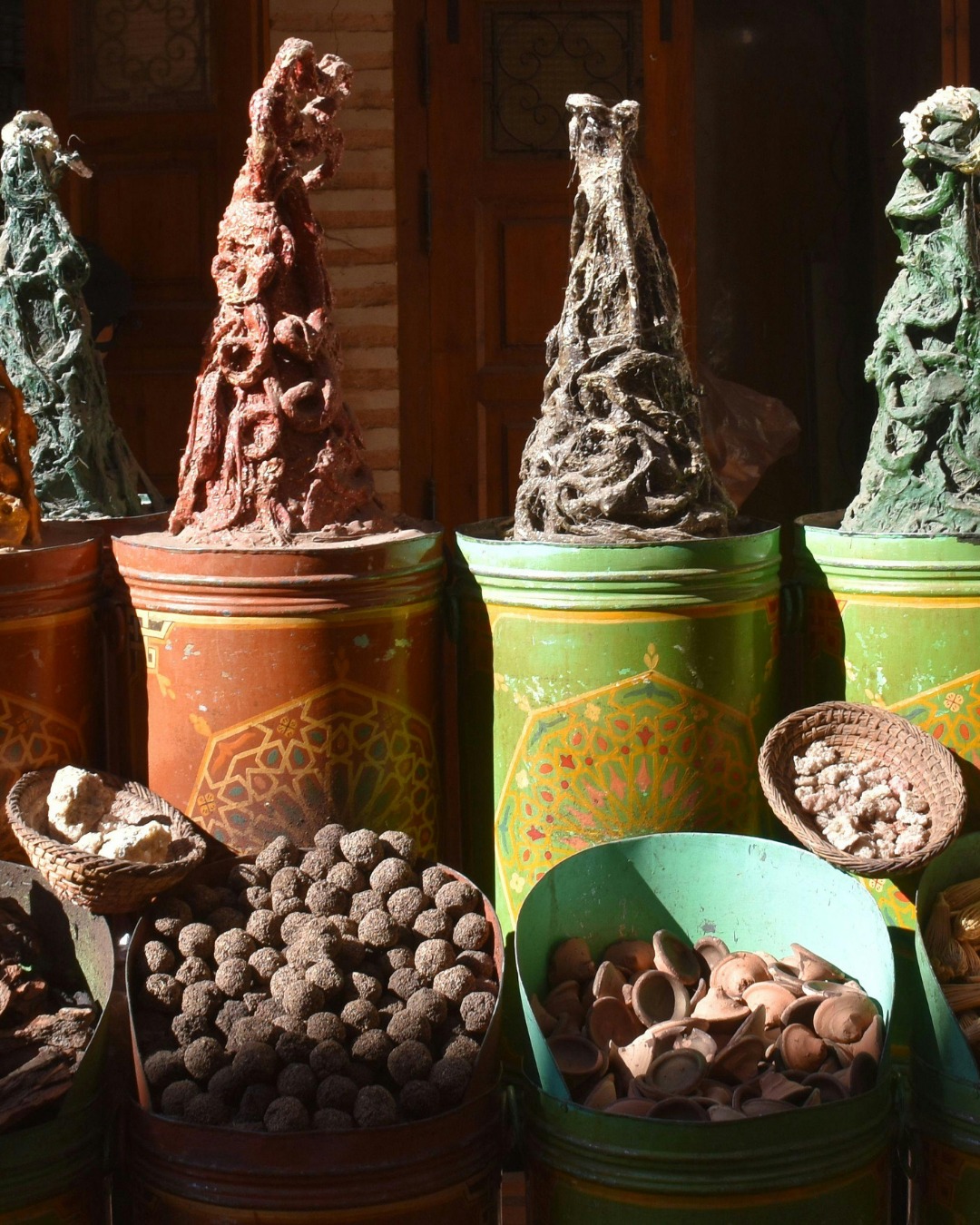 Vendors selling saffron cumin and Moroccan spices in Souk el Attarine