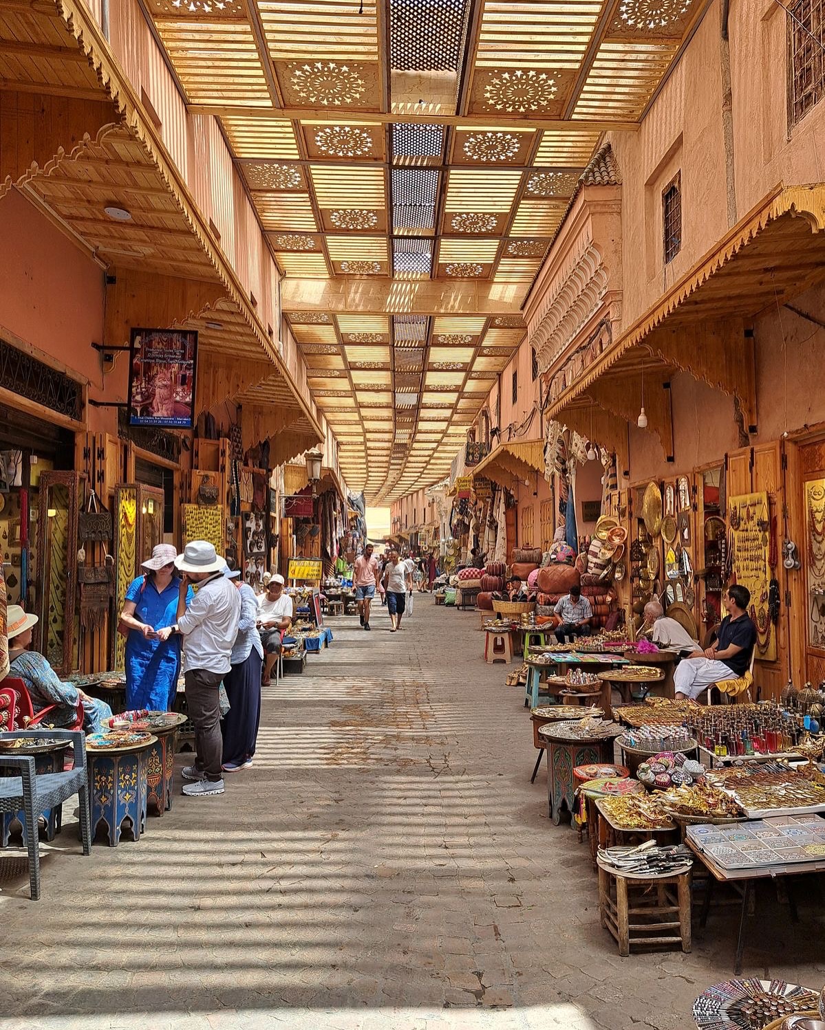 Colorful traditional souks in the Marrakech medina with crafts and textiles