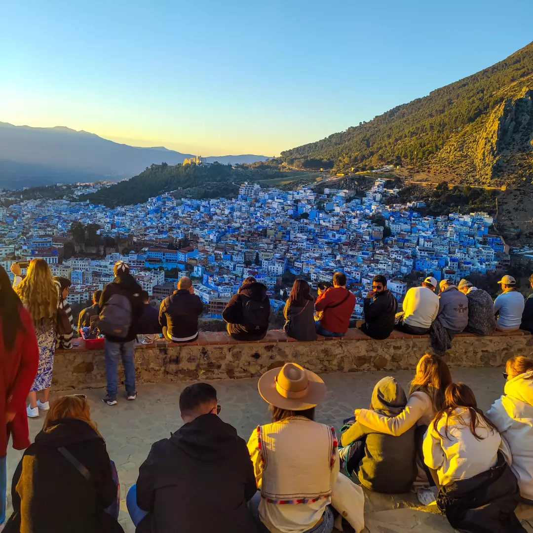 Chefchaouen blue streets sunset warm tones Morocco