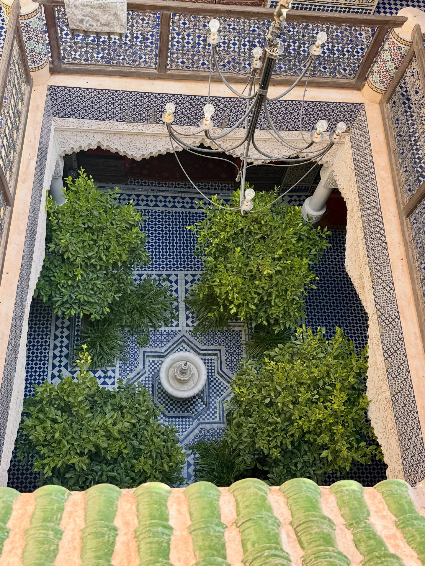 Ornate tiled courtyard inside a riad in Morocco