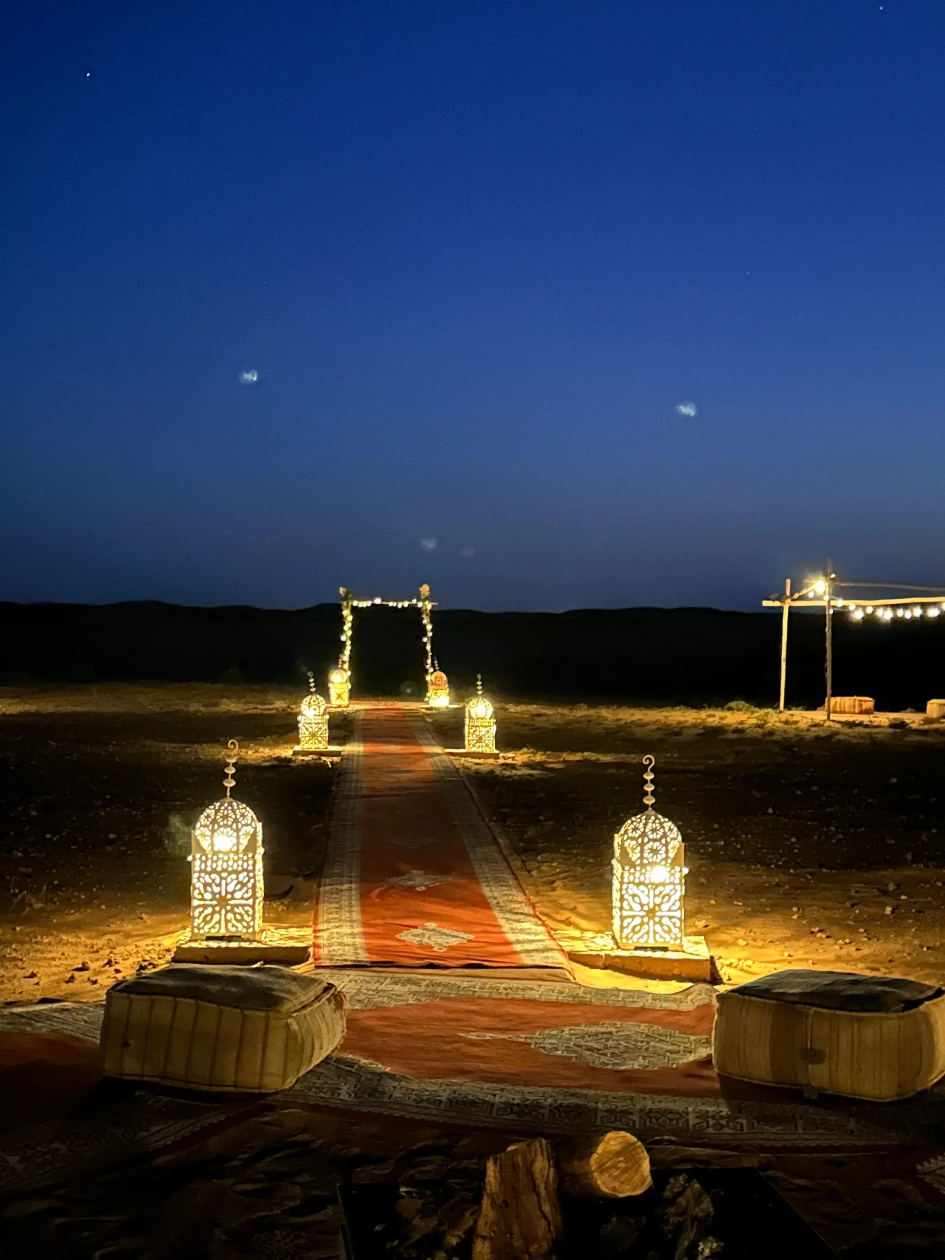 Luxury Berber camp at night in Sahara Desert Morocco with stars overhead
