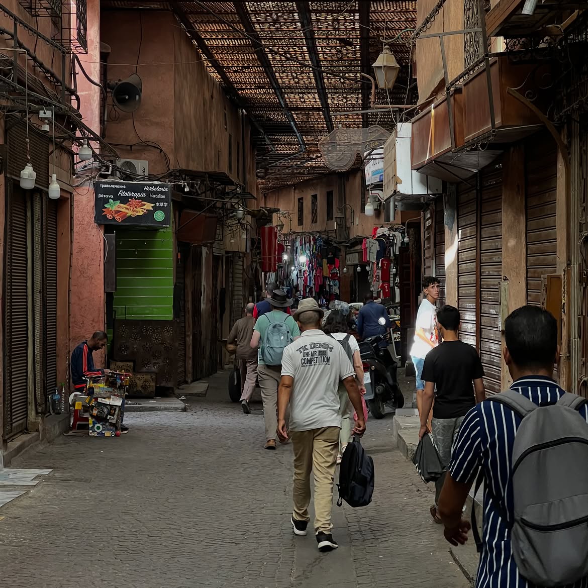 Tourists walking through Moroccan medina