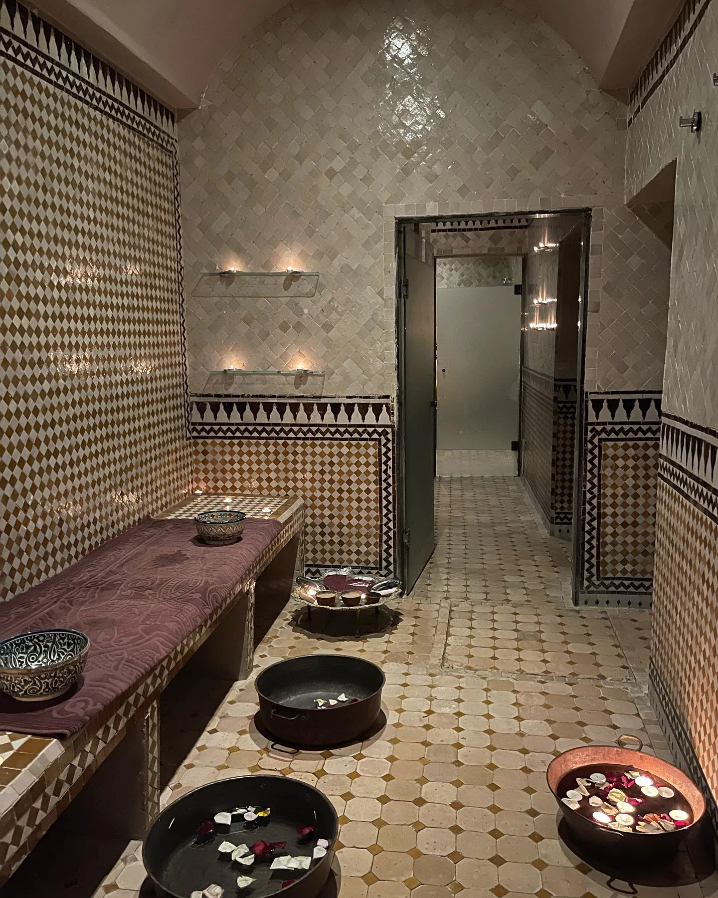 Traditional Moroccan hammam with marble interior and argan products