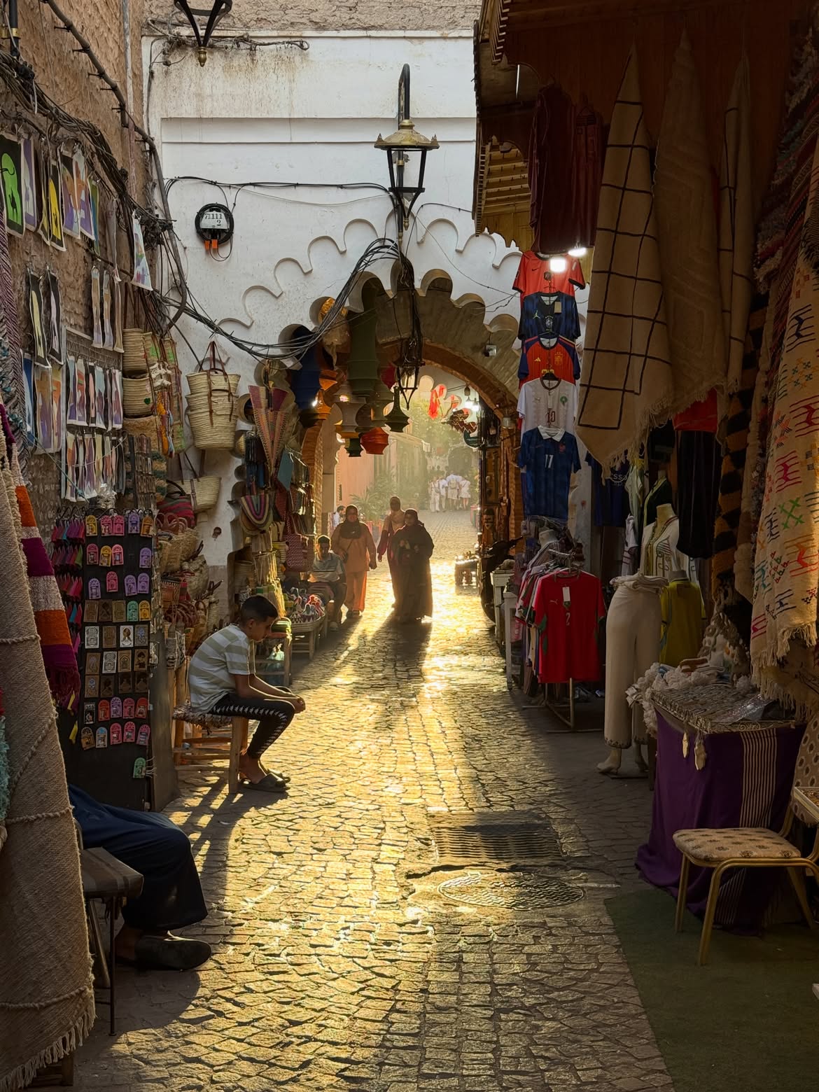 Traditional Moroccan medina street scene with colorful tiles and archways