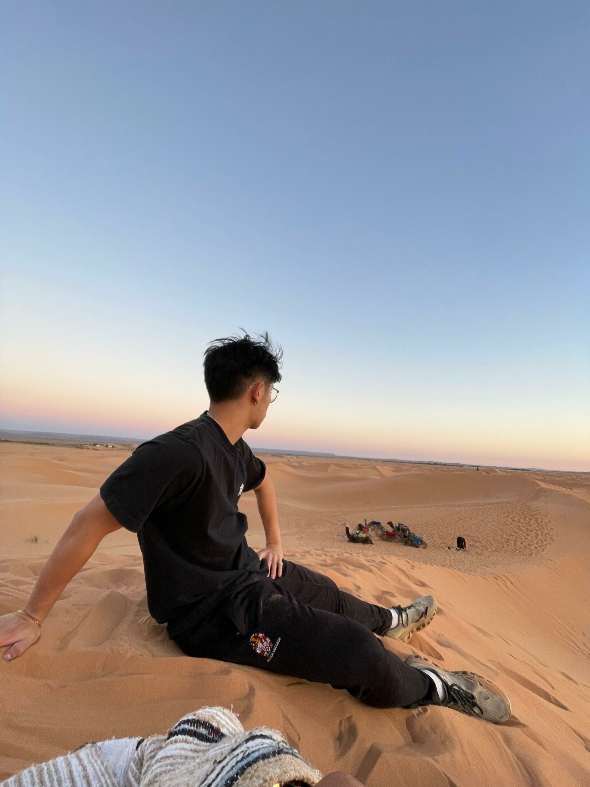 Luxury desert camp at sunset in Merzouga during a family tour in Morocco's Sahara