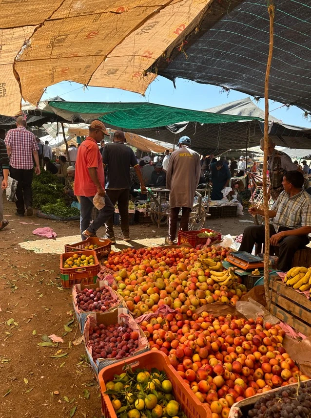 Tourists exploring a traditional Moroccan marketplace