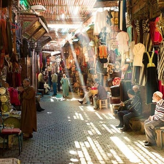 Sunny morning walk through the souks of Marrakech medina