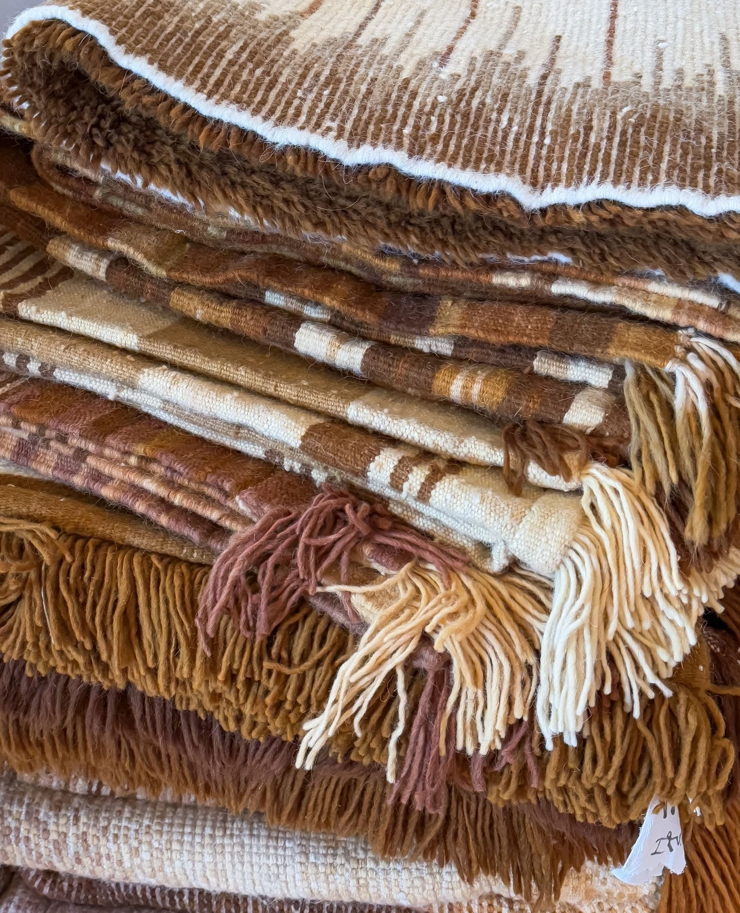 Close-up of natural dye colors in a handwoven Moroccan Berber carpet showing rich organic tones