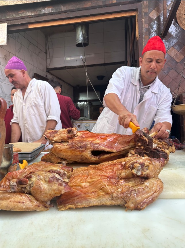 Chez Lamine Marrakech mechoui lamb being carved