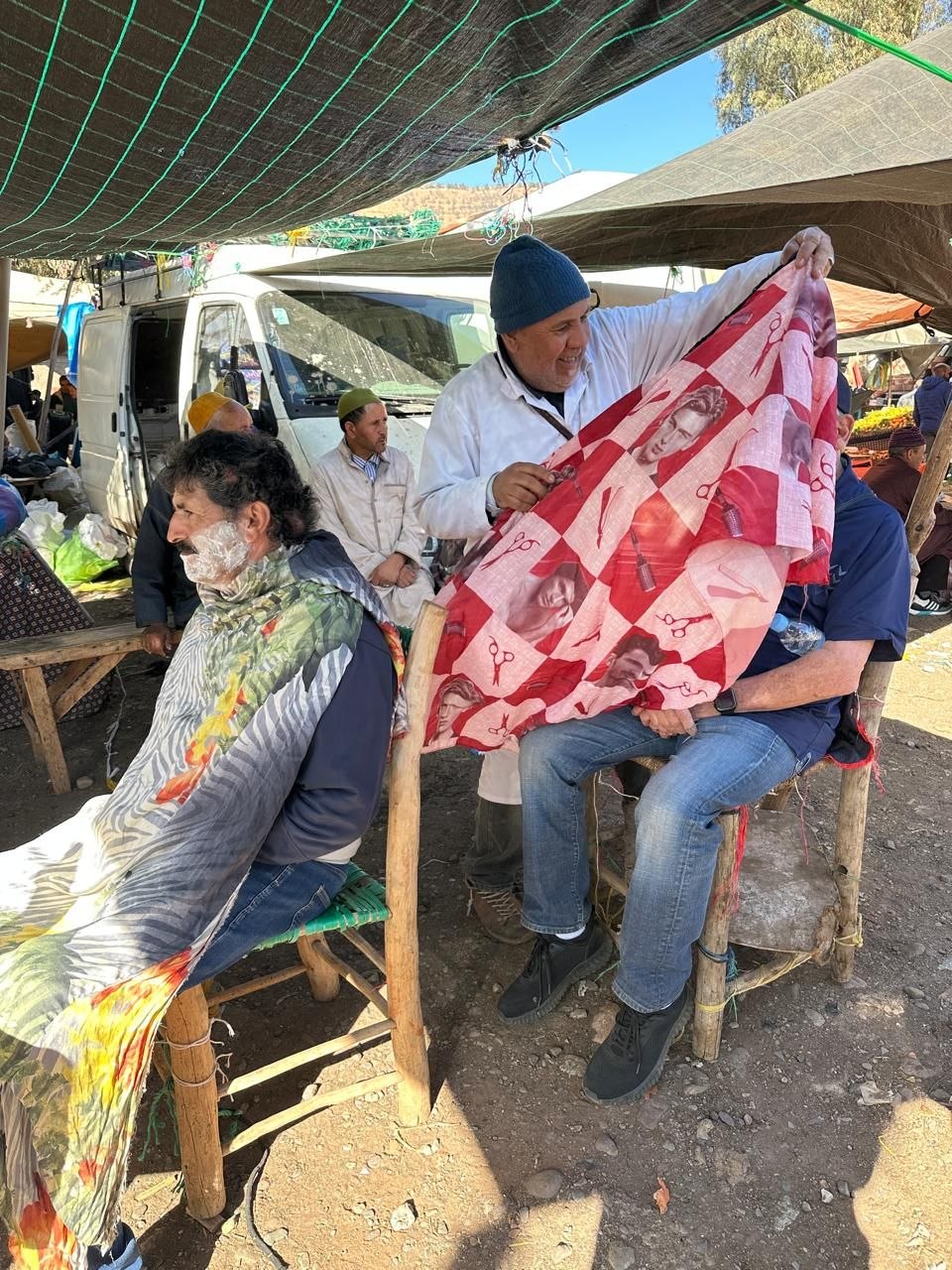 The traditional barber El Hajjam working at the Asni Saturday market