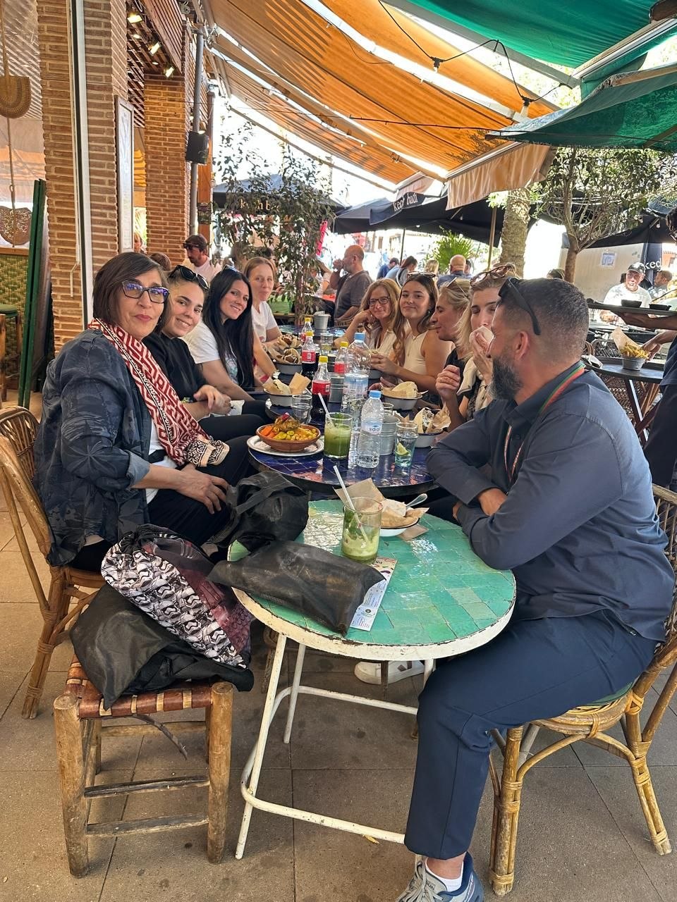 Guide Mouhssine with tour guests at Mazel Café Marrakech