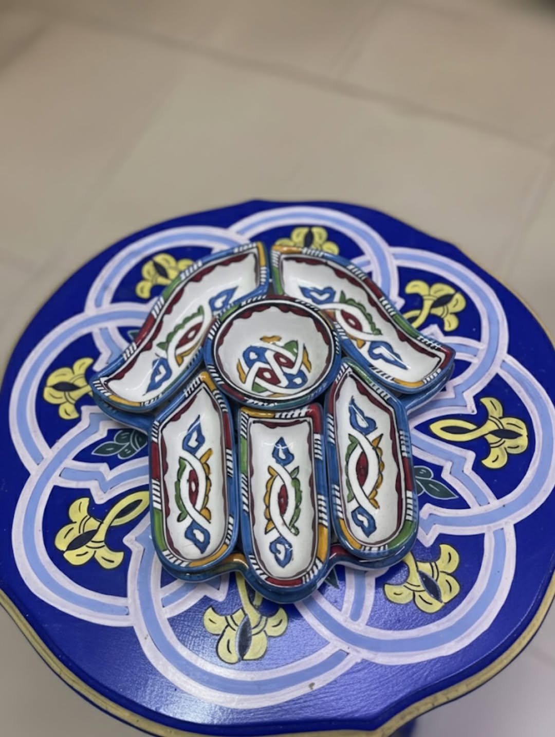 Hand of Fatima painted on traditional Moroccan pottery