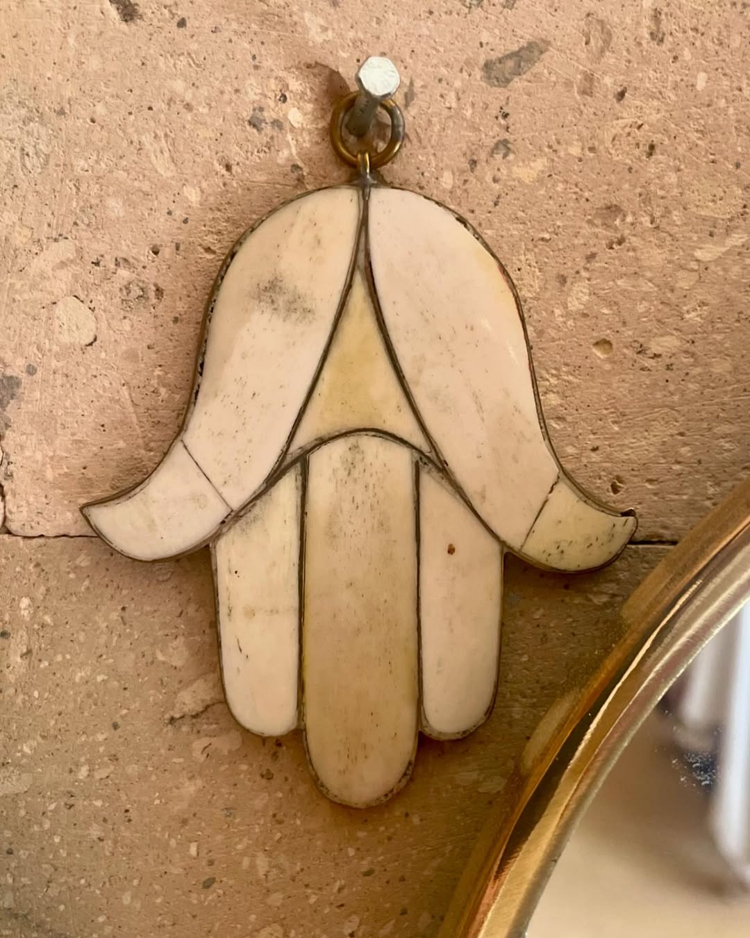 Hand of Fatima crafted from bone by Moroccan artisan
