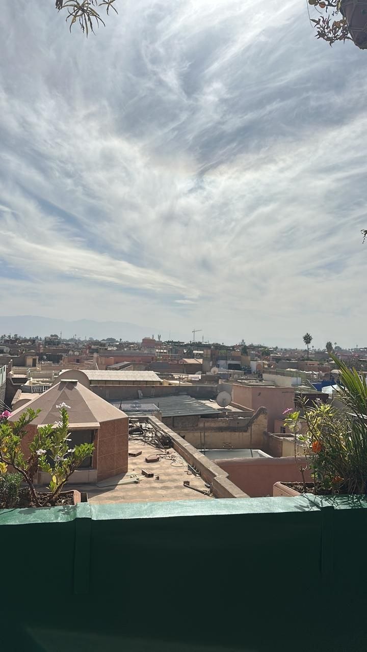L'Mida Marrakech restaurant interior and rooftop from above