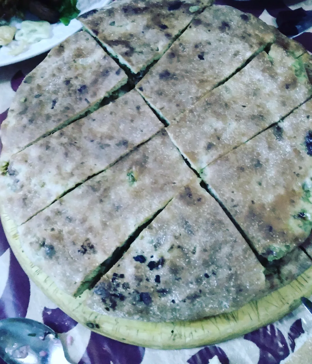 Traditional Madfouna Berber Pizza served in Morocco desert setting