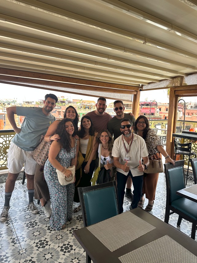 Tourists dining at Mythe Restaurant Marrakech with guide