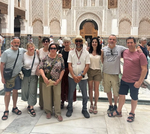 Mouhssine ELIOUJ with tourists exploring Marrakech medina