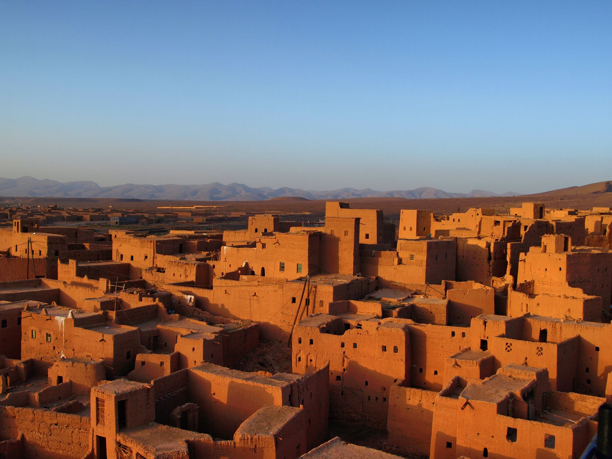 Panoramic view of Kasbah Oulad Othmane rising above the palm grove of the Draa Valley in Morocco