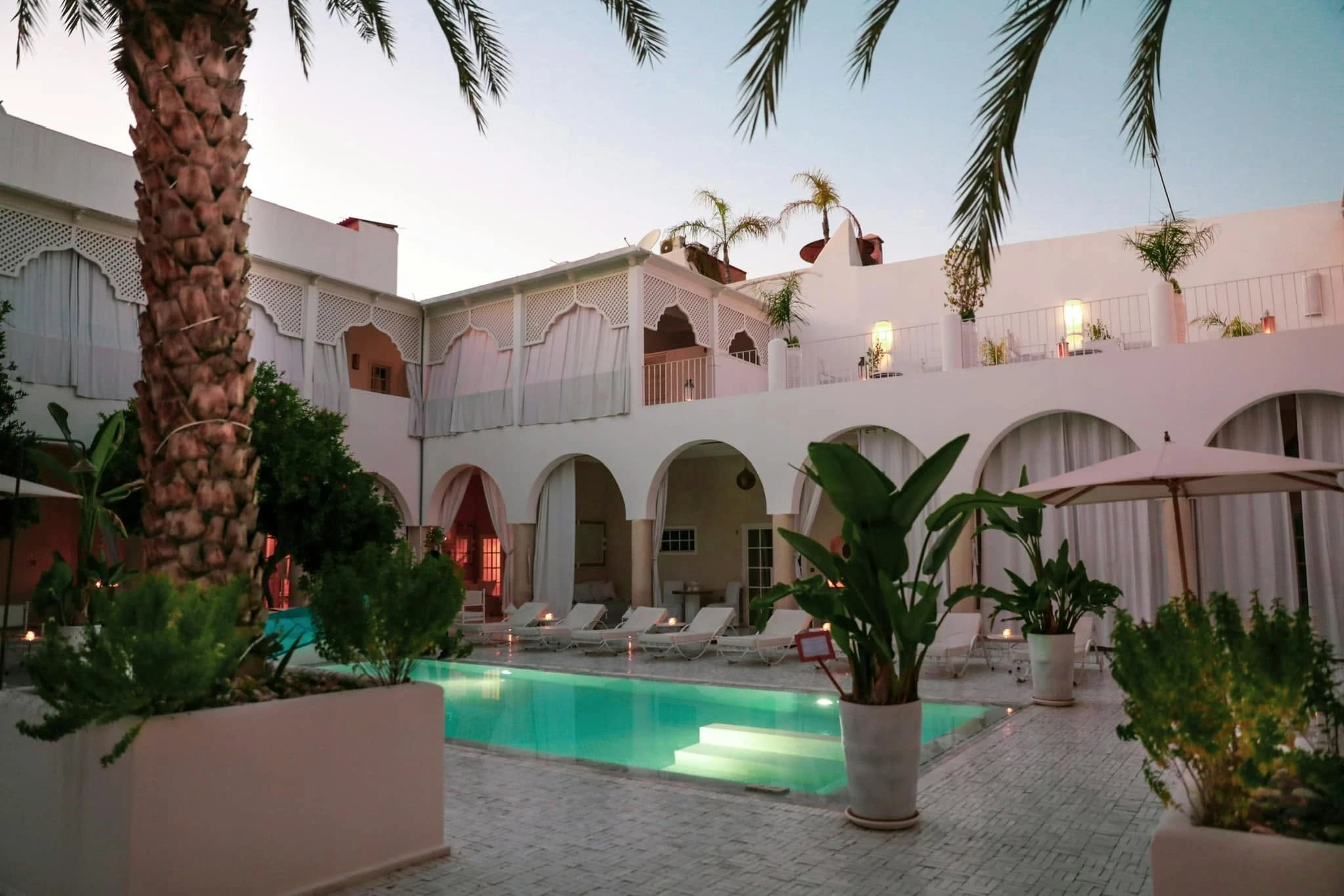 Courtyard of a luxury riad in Morocco at the end of the afternoon