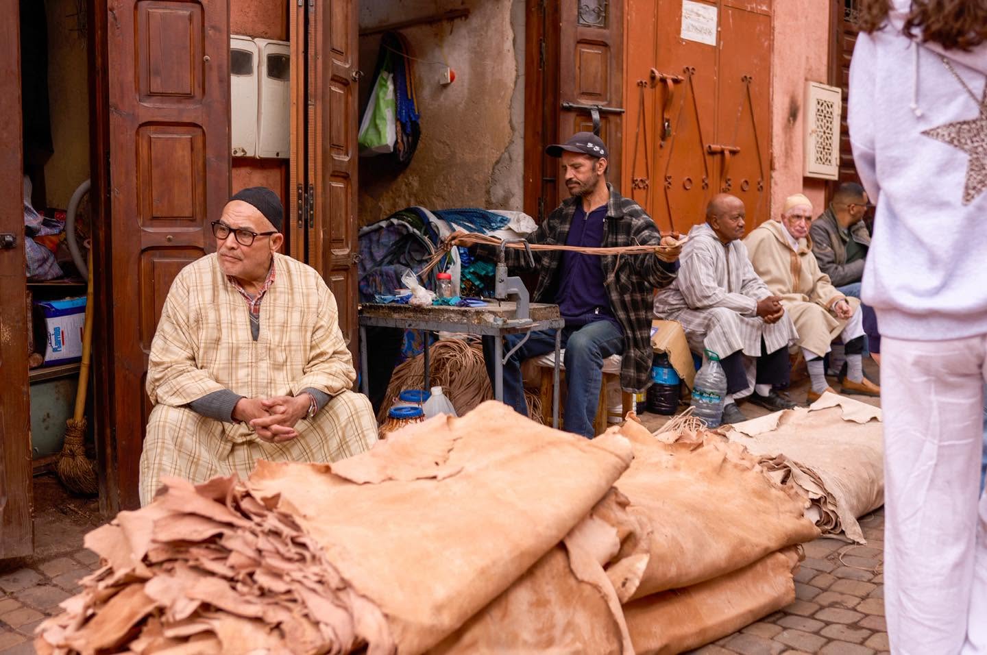 People going about their day in a street of the Marrakech medina