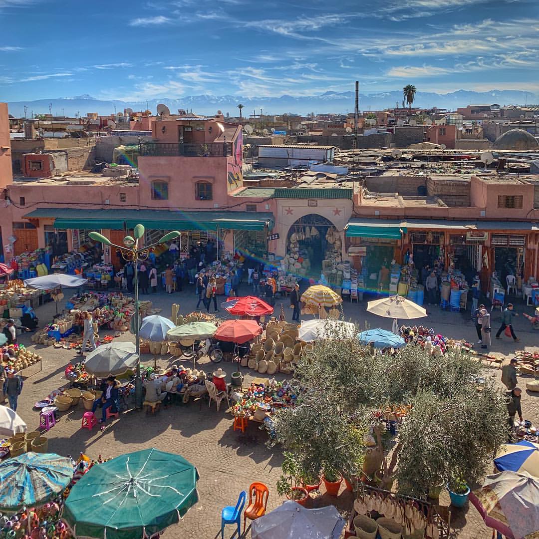 Spice and basket stalls on Rahba Kedima square in the Marrakech souks