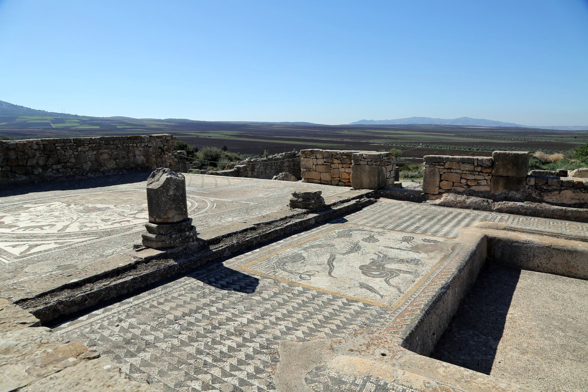 A mosaic floor inside one of the Roman houses at Volubilis, overlooking the plain below